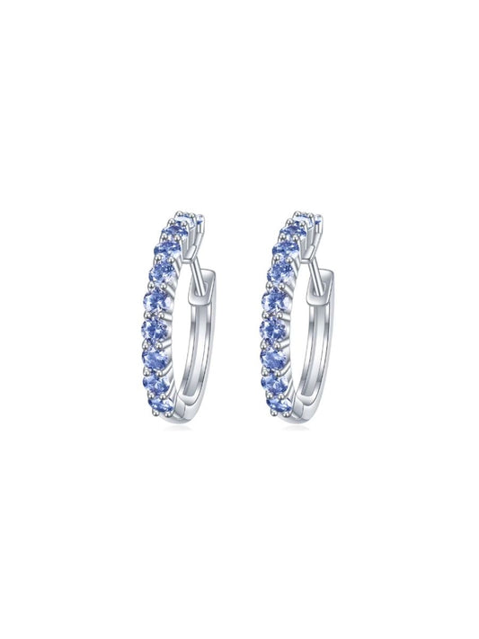 Arracadas Eternidad con Zirconia Azul Celeste en Plata 925 y Baño de Oro Blanco de 18 kt.