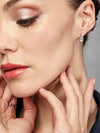 Aretes Lluvia de Luz con Topacio Sky Blue en Plata 925 y Baño de Oro Blanco de 18 kt.