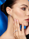 Arracadas Eternidad con Zirconia Azul Celeste en Plata 925 y Baño de Oro Blanco de 18 kt.